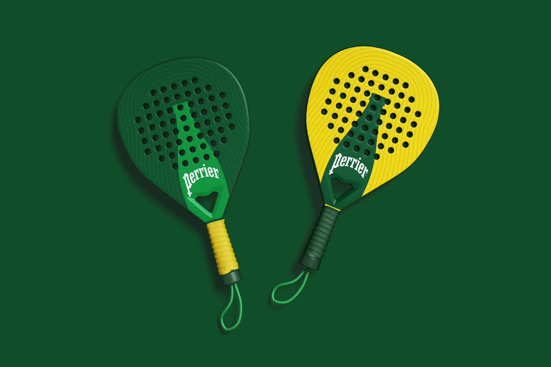 Two Perrier-branded padel paddles, one green and one yellow, product mockup