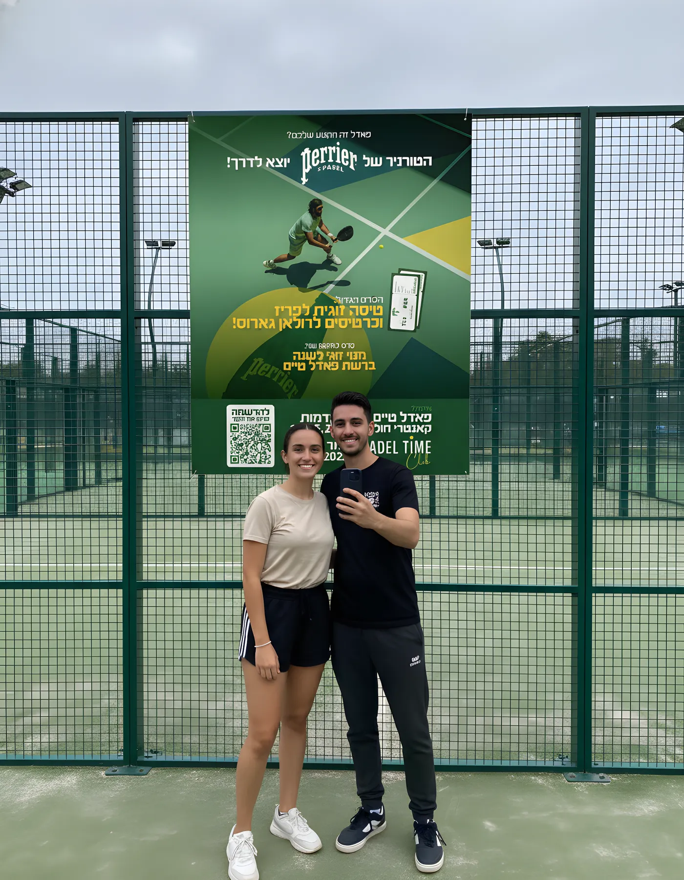 Players taking a selfie at the court with the sign-up QR code